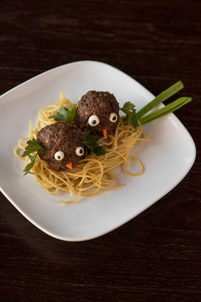 istock Funny meatballs with pasta 696304204