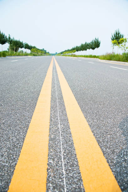 istock Double yellow lines on a road 696307906