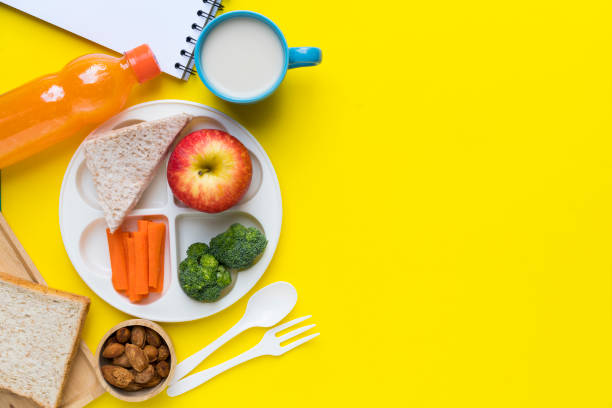 istock Healthy lunch box on yellow background 696307964