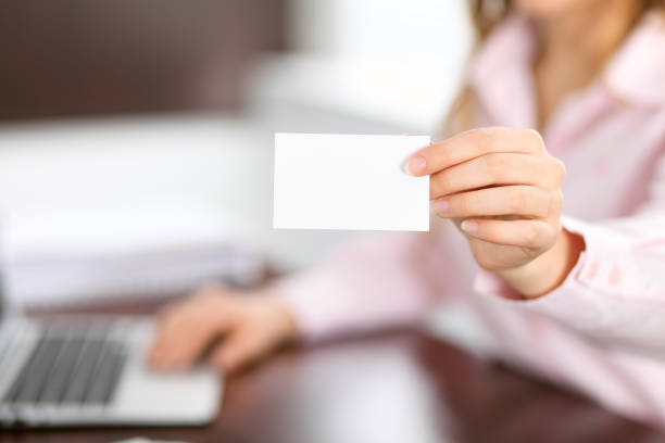 istock Business woman giving visit card 696310376