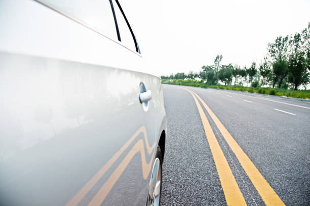 istock View from side of car on the road 696310924