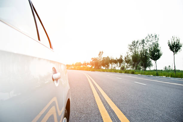 istock View from side of car on the road 696310948