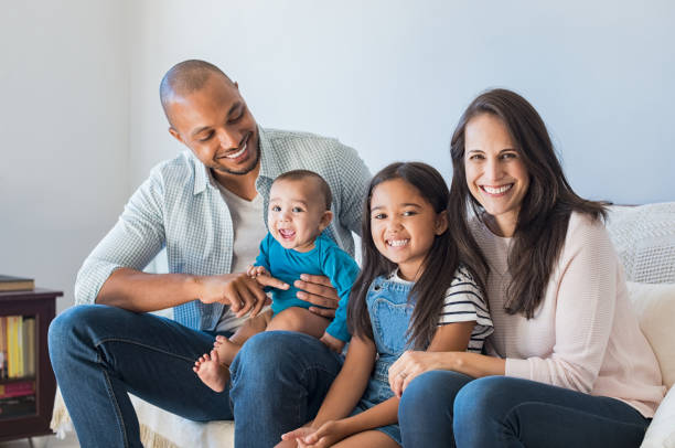 istock Happy multiethnic family on sofa 696311522