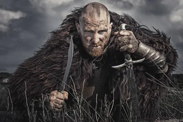 Caucasian Bearded Viking Man in the Dunes at Daytime