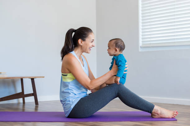 istock Woman doing yoga with son 696314380