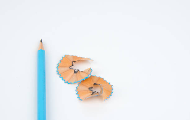 istock green pencil with cuttings in curve shape isolated on white. 696314508