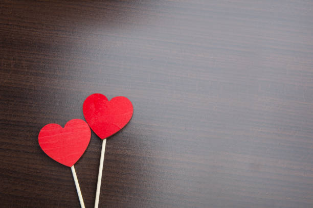 istock Valentines day concept. red glitter hearts on wooden background. Flat lay composition 696314674