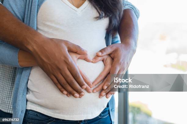 Multiethnic Couple Expecting A Baby Stock Photo - Download Image Now - Pregnant, Couple - Relationship, African-American Ethnicity