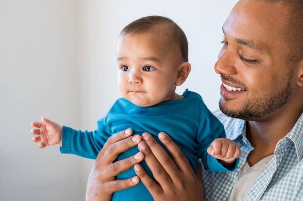 istock Father with cute baby 696314736