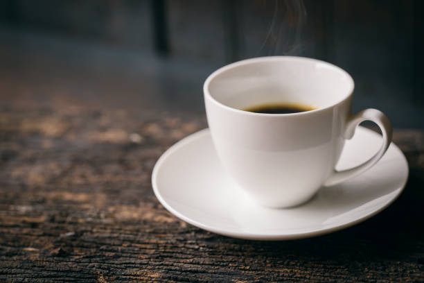 istock Hot Coffee, Espresso Coffee cup. White coffee cup on wood table. 696315530