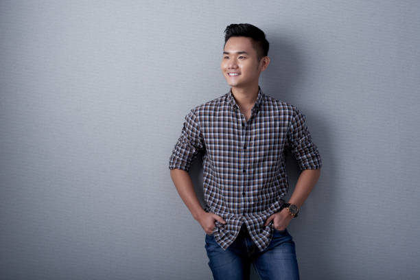 istock Studio Shot of Dreamy Asian Man 696317858