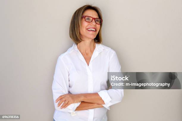 Business Woman With Glasses Smiling Stock Photo - Download Image Now - Women, Mature Women, One Woman Only