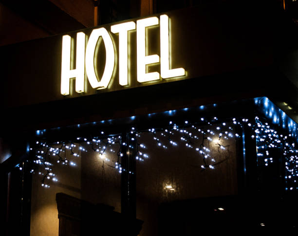 istock Hotel glowing sign at night. 696322974