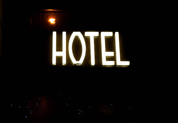 istock Hotel glowing sign at night. 696323048
