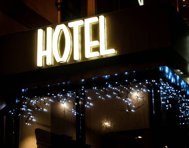 istock Hotel glowing sign at night. 696330022