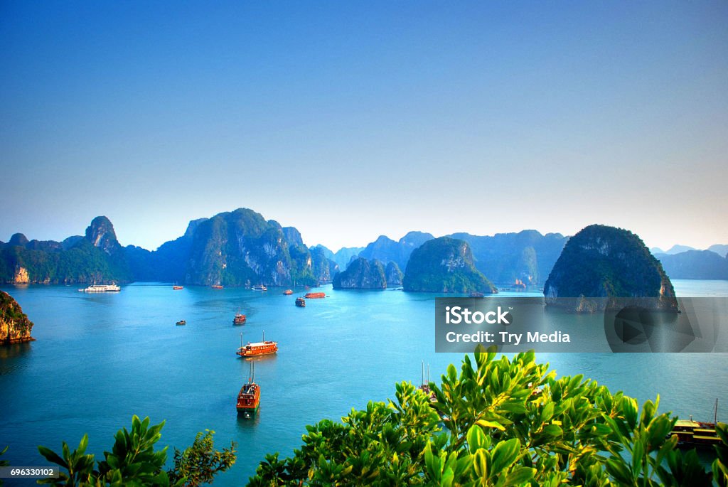 Aerial view of boats sailing in Halong Bay Vietnam Aerial view of traditional junks sailing in Halong Bay Vietnam Hạ Long Bay Stock Photo