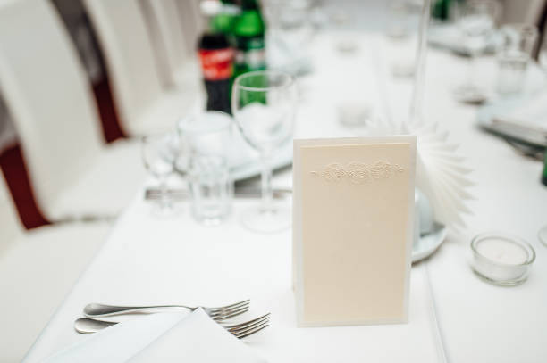 istock Blank bright yellow place card on wood table 696333794