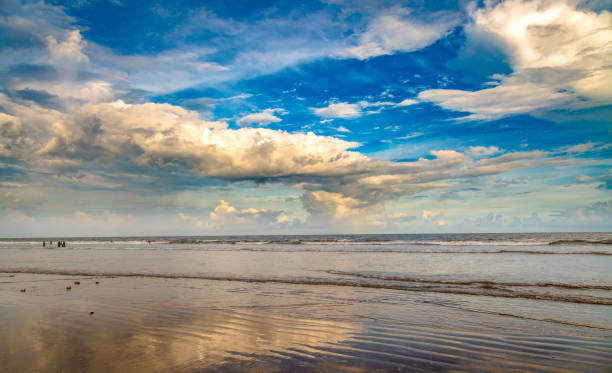 istock Moody sky with cloudscape at sea beach before sunset. 696334274