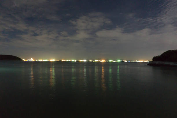 istock night view of beach and sea with light 696338282