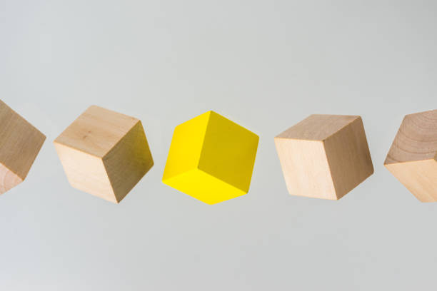 istock Abstract geometric real floating wooden cube on grey background 696342030