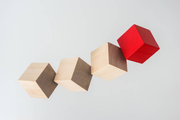 istock Abstract geometric real floating wooden cube on grey background 696342354