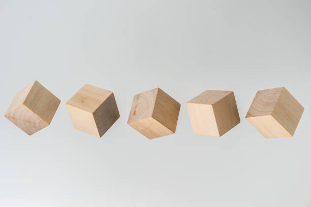 istock Abstract geometric real floating wooden cube on grey background 696342738
