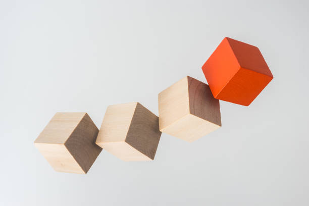 istock Abstract geometric real floating wooden cube on grey background 696345340