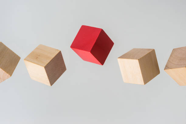 istock Abstract geometric real floating wooden cube on grey background 696345394