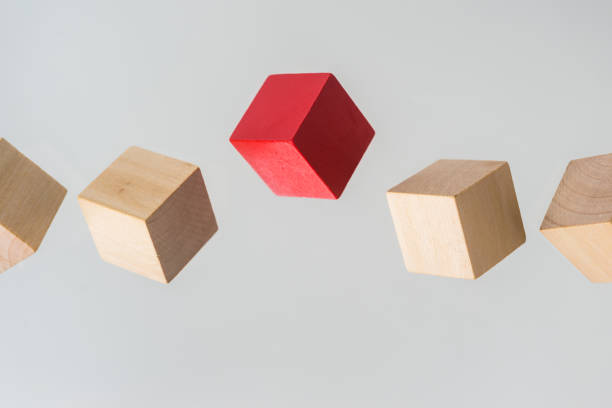 istock Abstract geometric real floating wooden cube on grey background 696345448