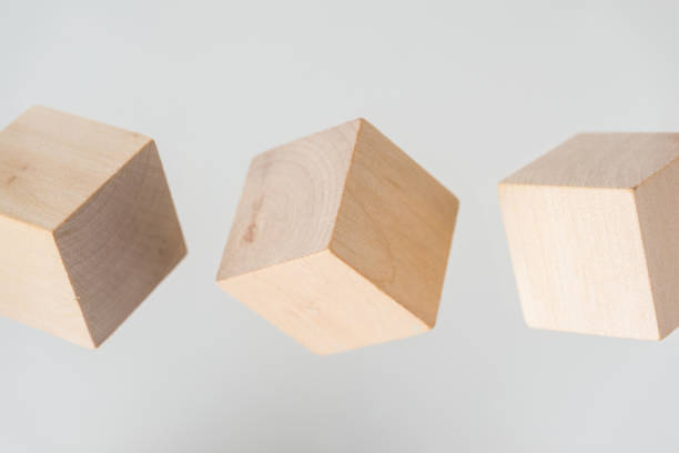 istock Abstract geometric real floating wooden cube on grey background 696345630
