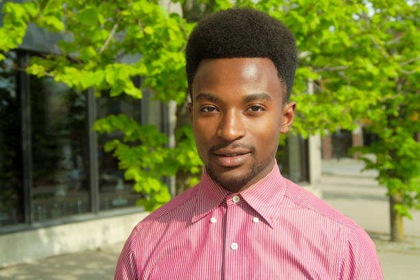 istock young man on the sidewalk downtown portrait 696346580