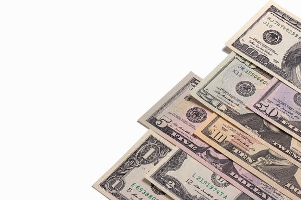 istock US american dollar money bills isolated on white background. 696349226