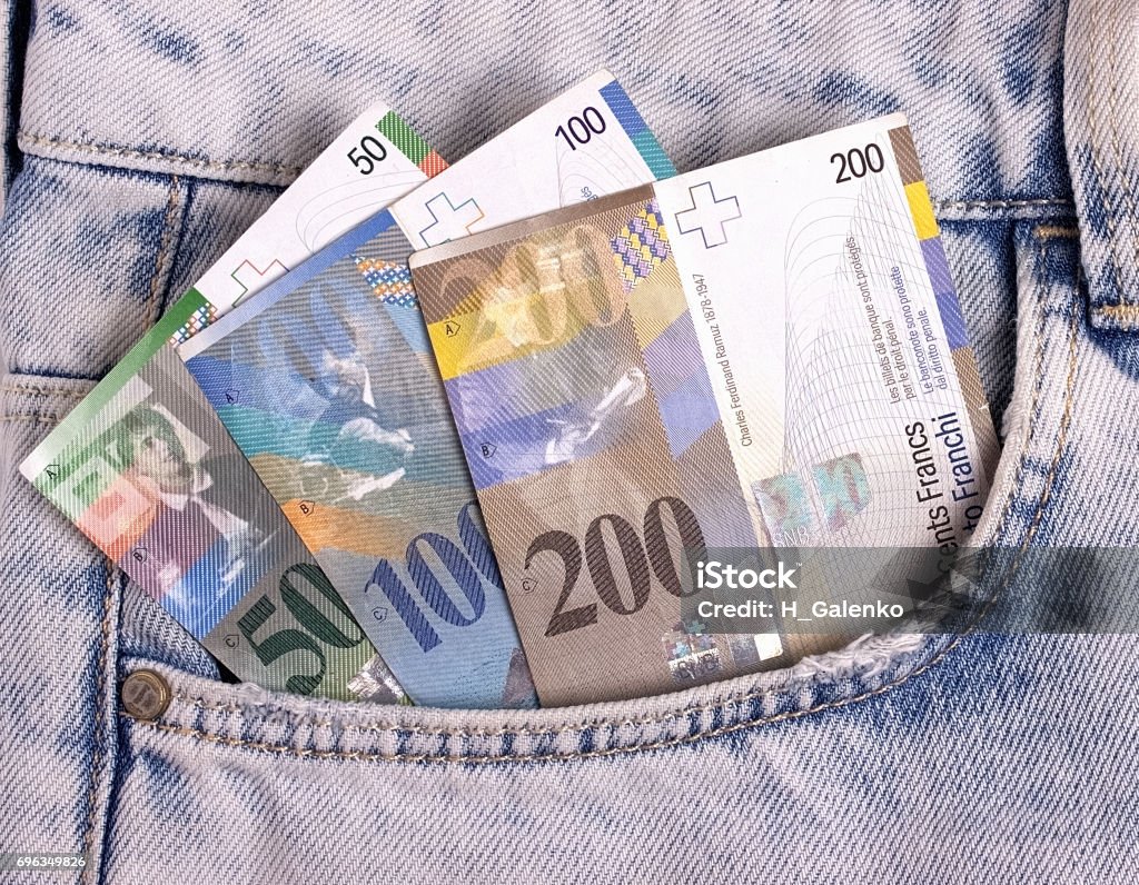 Closeup of the swiss notes in the jeans pocket. Closeup of the swiss notes in the jeans pocket Arts Culture and Entertainment Stock Photo