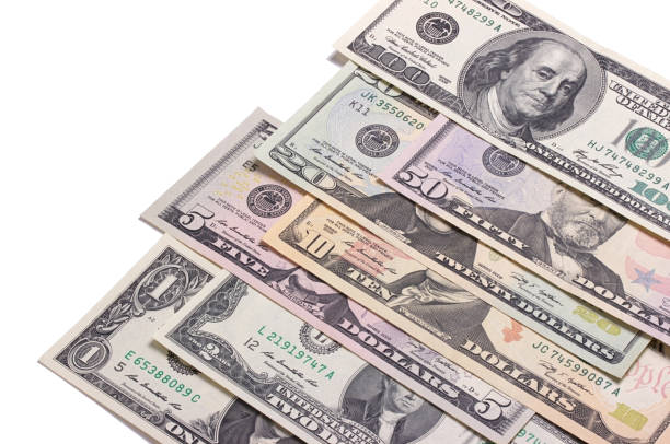 istock US american dollar money bills isolated on white background. 696350338