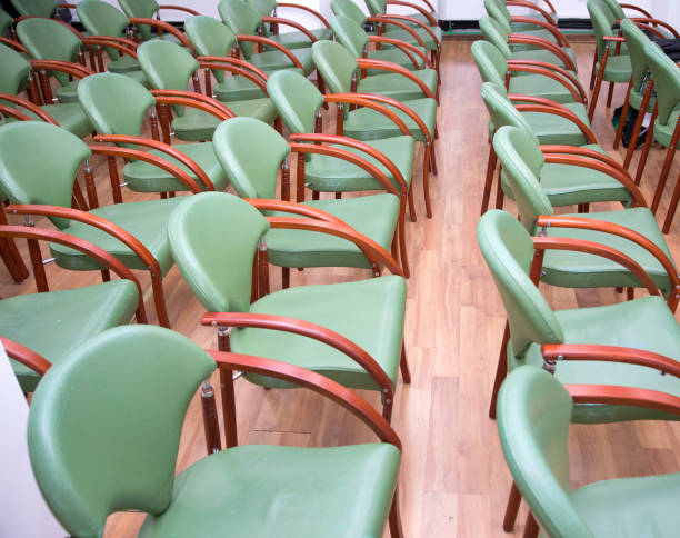 istock Comfortable seats in empty corporate meeting office for  presentation 696354704