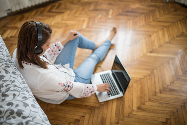 istock Listening to music at home 696355028