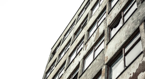 istock facade of the old Soviet office building with broken windows. sad sight 696357056