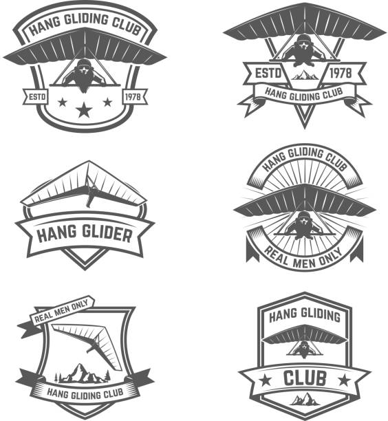 Hang gliding club emblems. Design elements for label, badge, sign. Vector illustration Hang gliding club emblems. Design elements for label, badge, sign. Vector illustration glider hang glider hanging sky stock illustrations