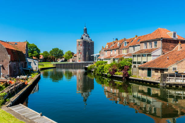 Houses along canal in Enkhuizen Netherlands Houses along canal in Enkhuizen Netherlands enkhuizen stock pictures, royalty-free photos & images