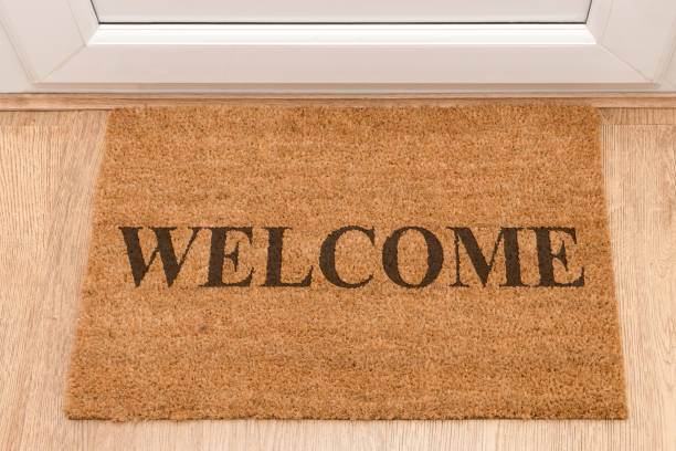 istock Welcome door mat at front door 696371270