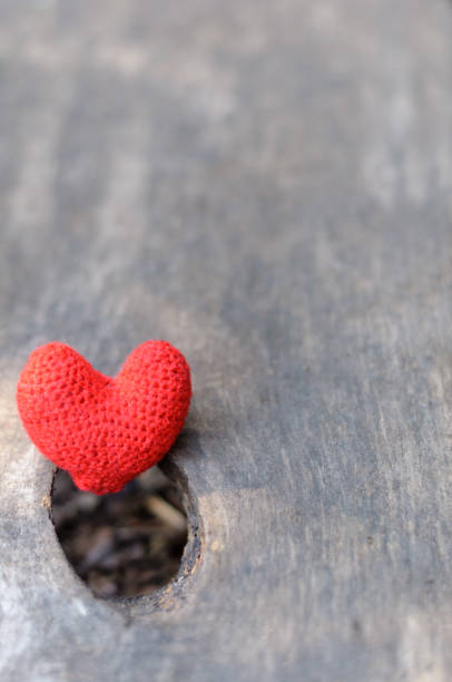 istock Red heart on wooden background 696372260