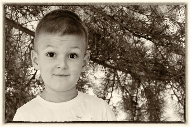 istock Little boy smiling outdoors 696377140