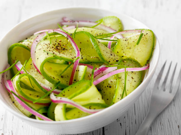 Cucumber Salad Cucumber Salad with Red Onion and Fresh Chives side salad stock pictures, royalty-free photos & images