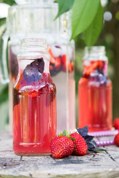 istock Lemonade detox strawberry basil. refreshing drink with fresh strawberry and basil on the background of the garden 696387152