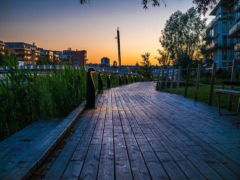 Dock walking path lighted evening. Hammarby Sjöstad in Stockholm, Sweden