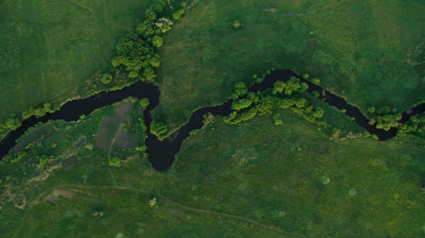 istock A beautiful narrow and winding river view from above. 696387880