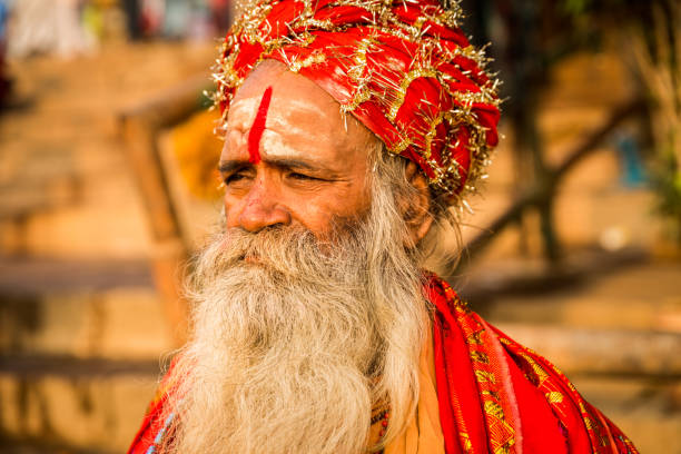 Jaipur, India, November 30, 2012: Indian man with long beard and the typical indian tilak symbol on the forehead, looking at the camera. Image taken on the street