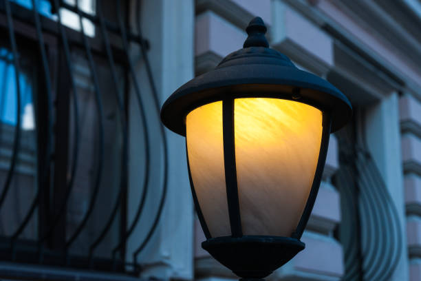 istock Yellow lamp in the blue street 696395072