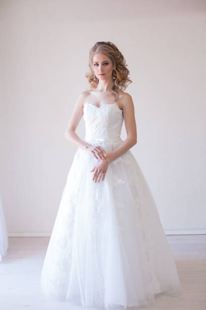 istock bride in white dress before wedding 696409946