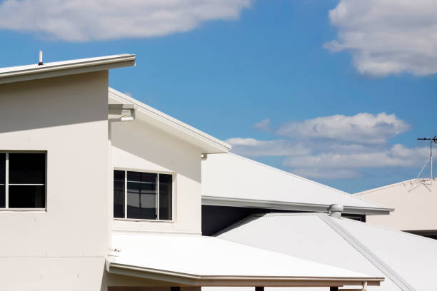 istock Closeup modern houses against sky background with copy space 696410182